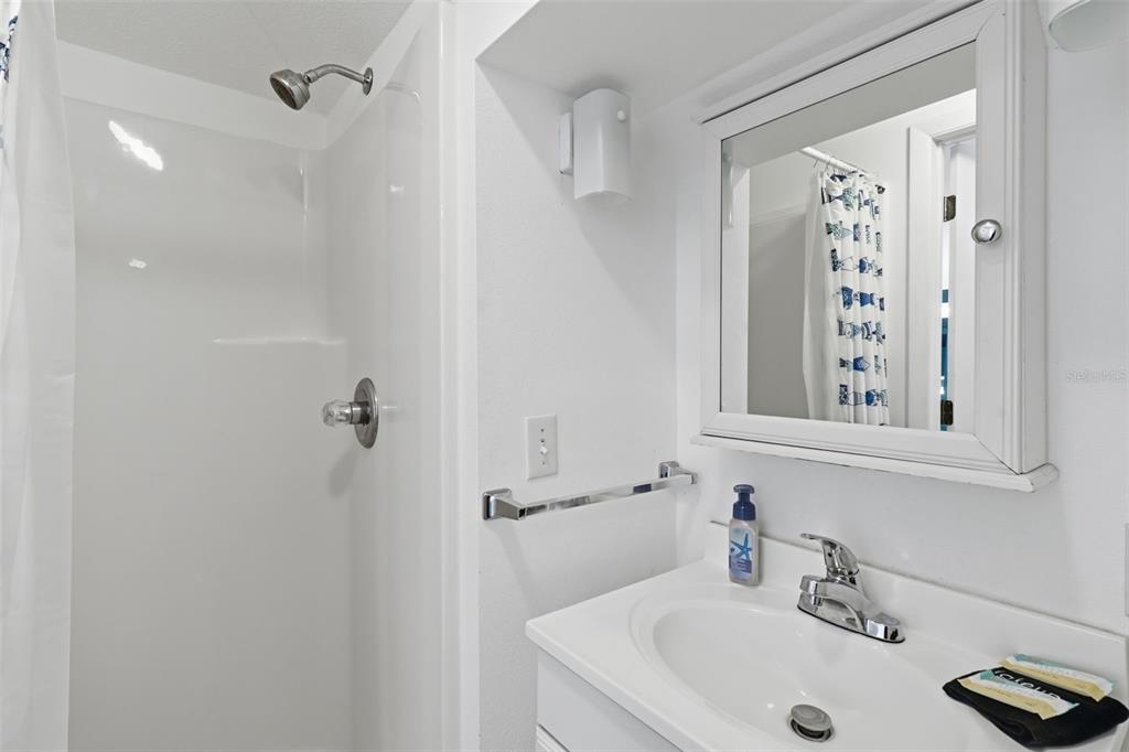 7324 Islander Lane Hudson, FL 34667 - Photo 27 of 35 a bathroom with a sink and a shower