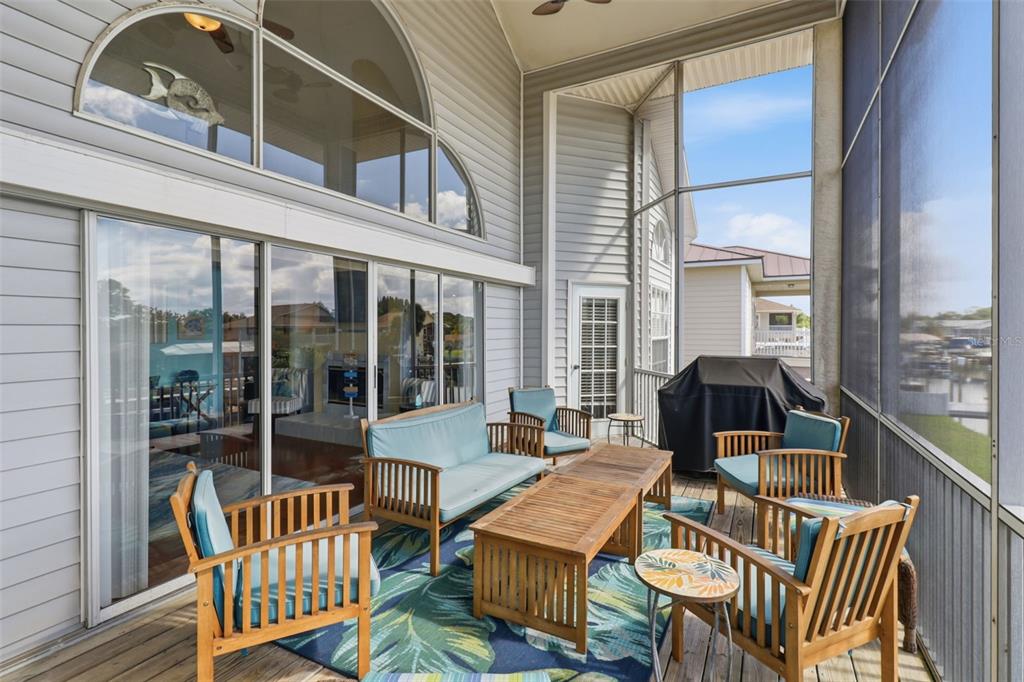 7324 Islander Lane Hudson, FL 34667 - Photo 29 of 35 a view of a patio with a table and chairs