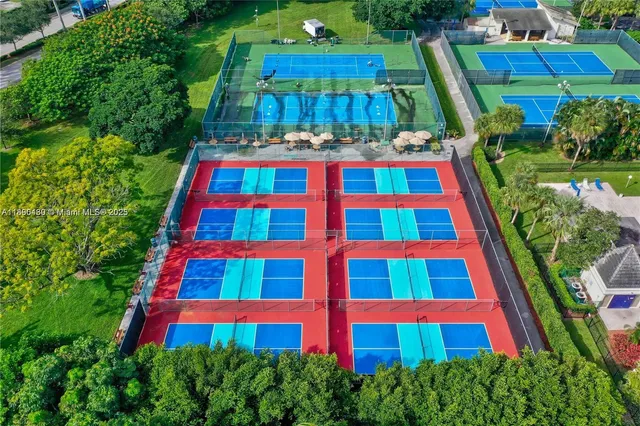 an aerial view of residential houses with outdoor space