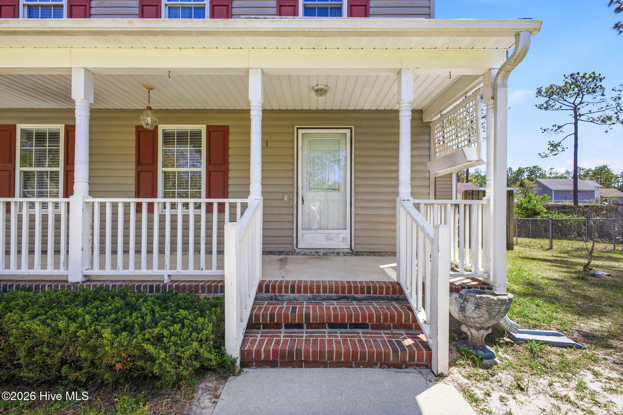 141 Crystal Road Southport, NC 28461 - Photo 2 of 40 141 Crystal Rd front porch