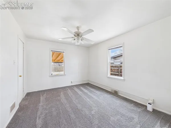 an empty room with windows
