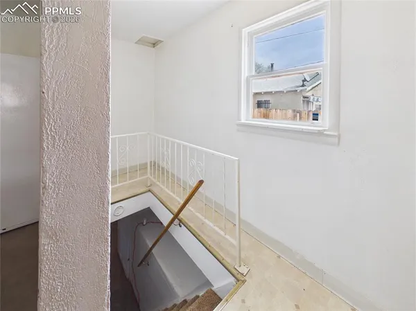 a view of staircase with wooden floor