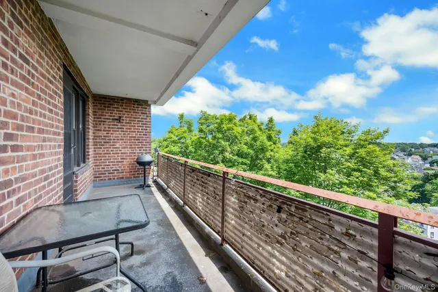 a view of balcony with furniture