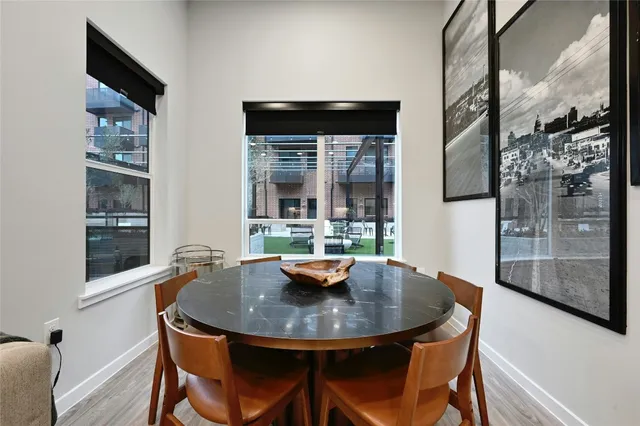 a view of a dining room with furniture and window