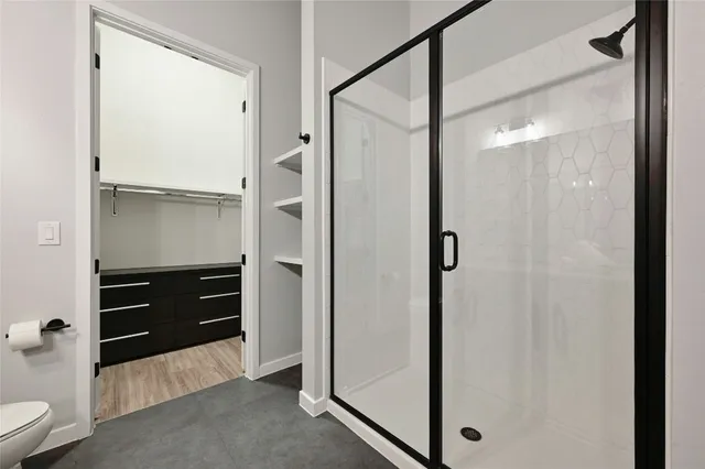 a bathroom with a shower and a tub