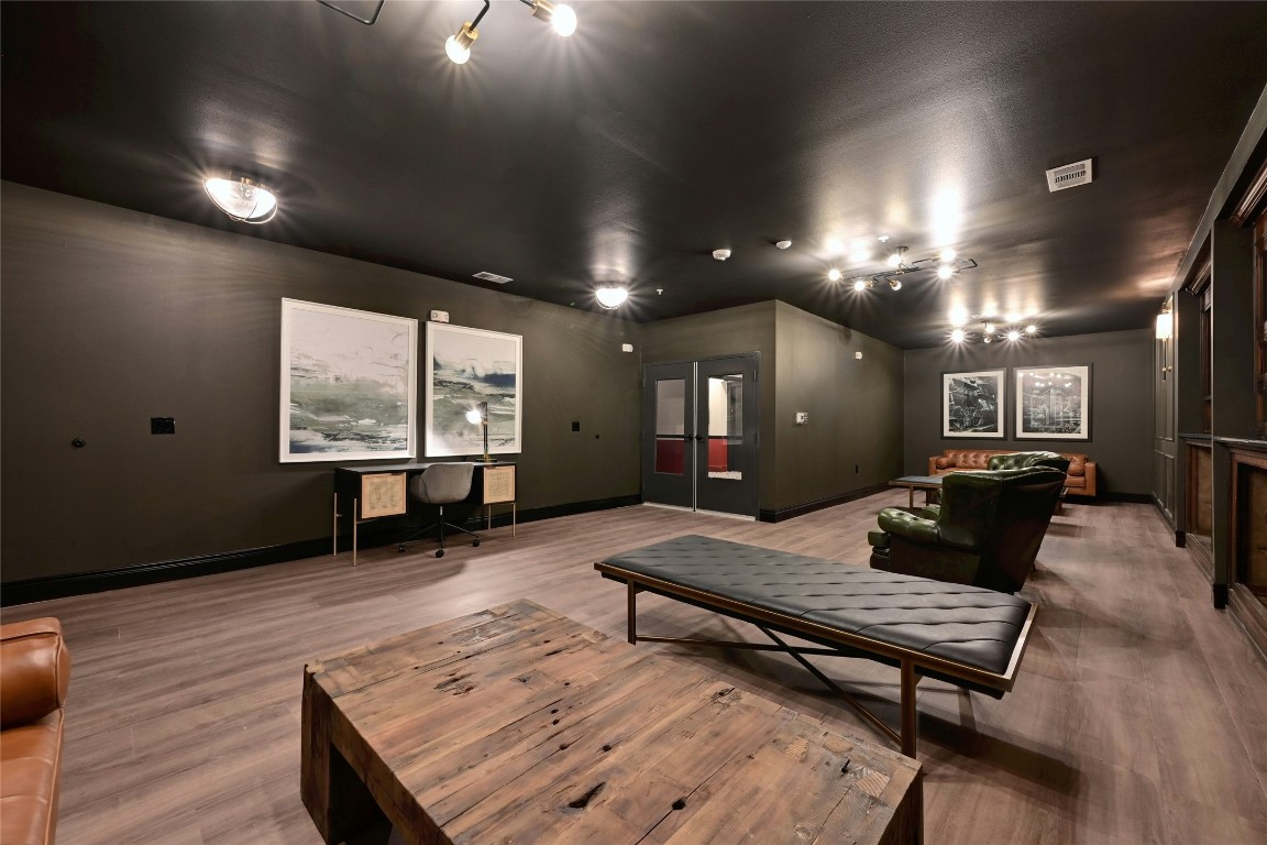 4510 Terry-O Lane, Unit 138 Austin, TX 78745 - Photo 40 of 40 a living room with furniture a large window and a wooden floor