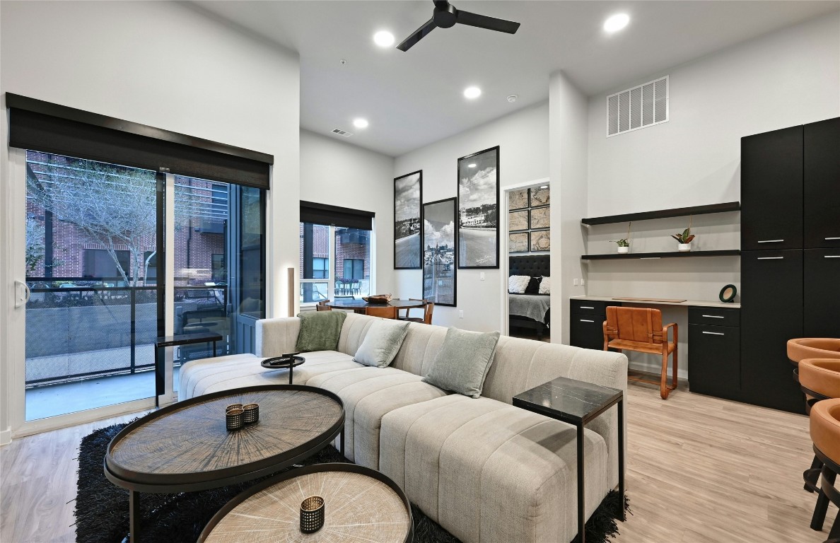4510 Terry-O Lane, Unit 138 Austin, TX 78745 - Photo 6 of 40 a living room with furniture a lamp and a fireplace