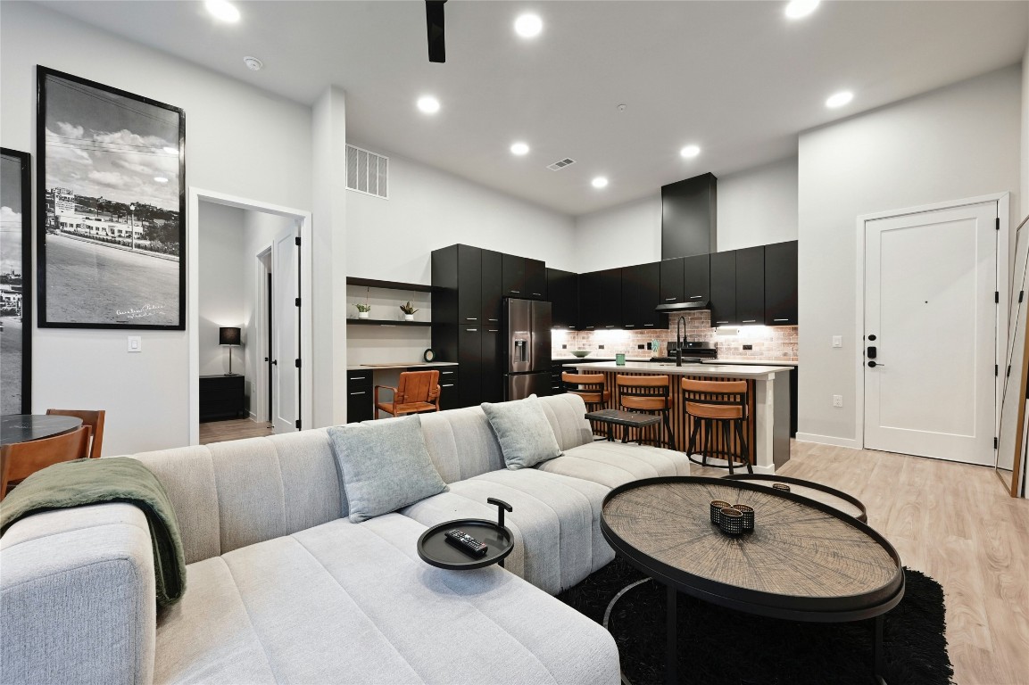 4510 Terry-O Lane, Unit 138 Austin, TX 78745 - Photo 8 of 40 a living room with furniture and kitchen view