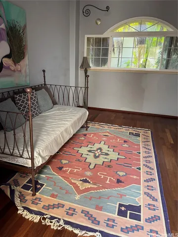 a living room with furniture and a lamp