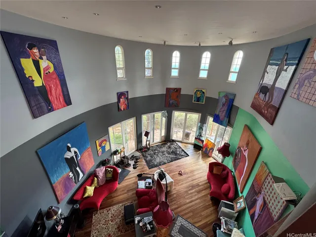 a kitchen with stainless steel appliances granite countertop a stove and a wooden floor