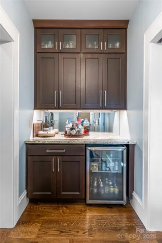 a kitchen with a sink cabinets and a fireplace