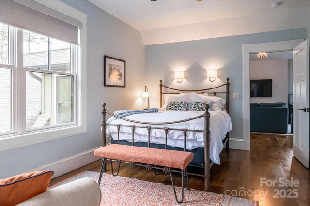 a bedroom with furniture and a window