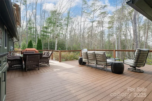 a balcony with chairs and a table