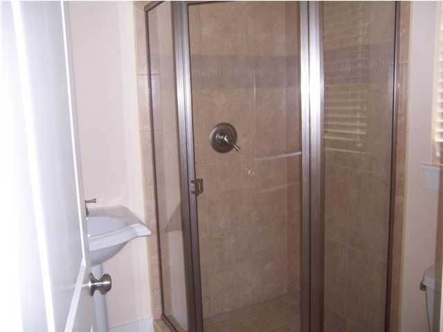 27 Pompano Ct Inlet Beach Inlet Beach, FL 32461 - Photo 19 of 23 a bathroom with a glass shower door