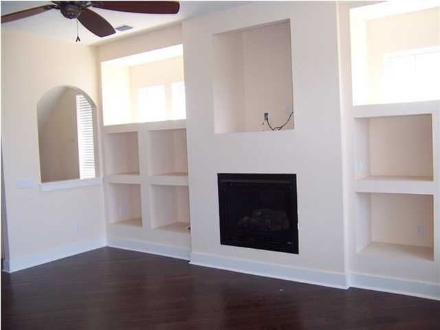 27 Pompano Ct Inlet Beach Inlet Beach, FL 32461 - Photo 4 of 23 a view of a livingroom with wooden floor and a fireplace