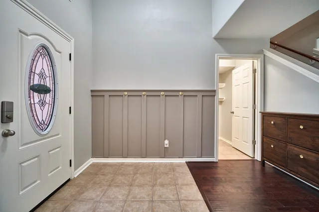 a view of an entryway with wooden floor