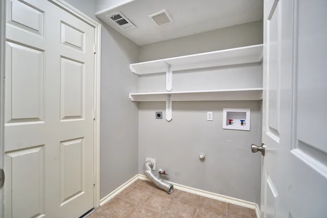 a view of a room with rack on the wall