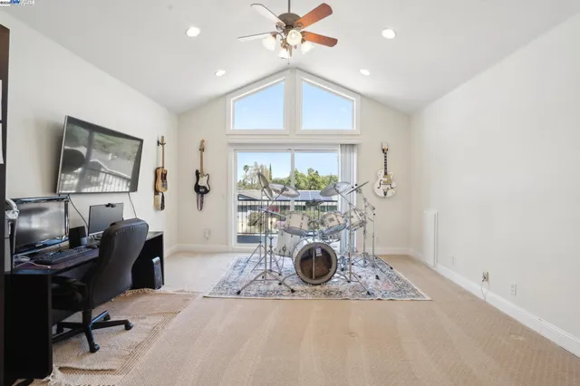 a balcony with wooden floor and city view