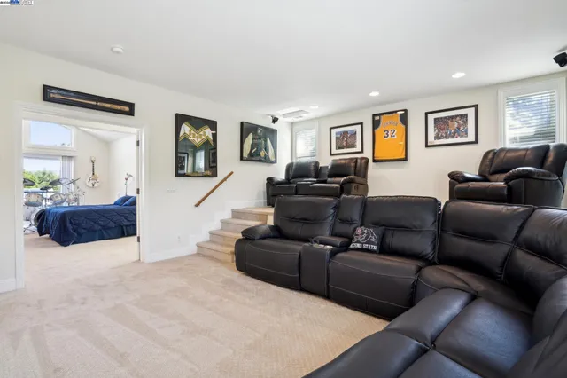 a bedroom with a bed and glass window