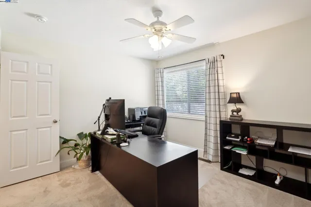 a view of a house with backyard porch and sitting area