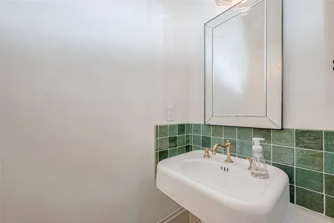 a bathroom with a sink and mirror