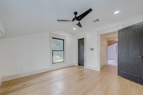 a view of an empty room with glass door