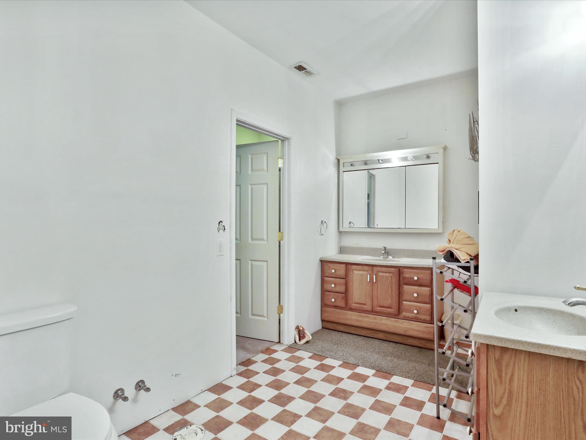 525 Rolling Rock Road Star Tannery, VA 22654 - Photo 31 of 69 a room with a baby crib and a wooden floor