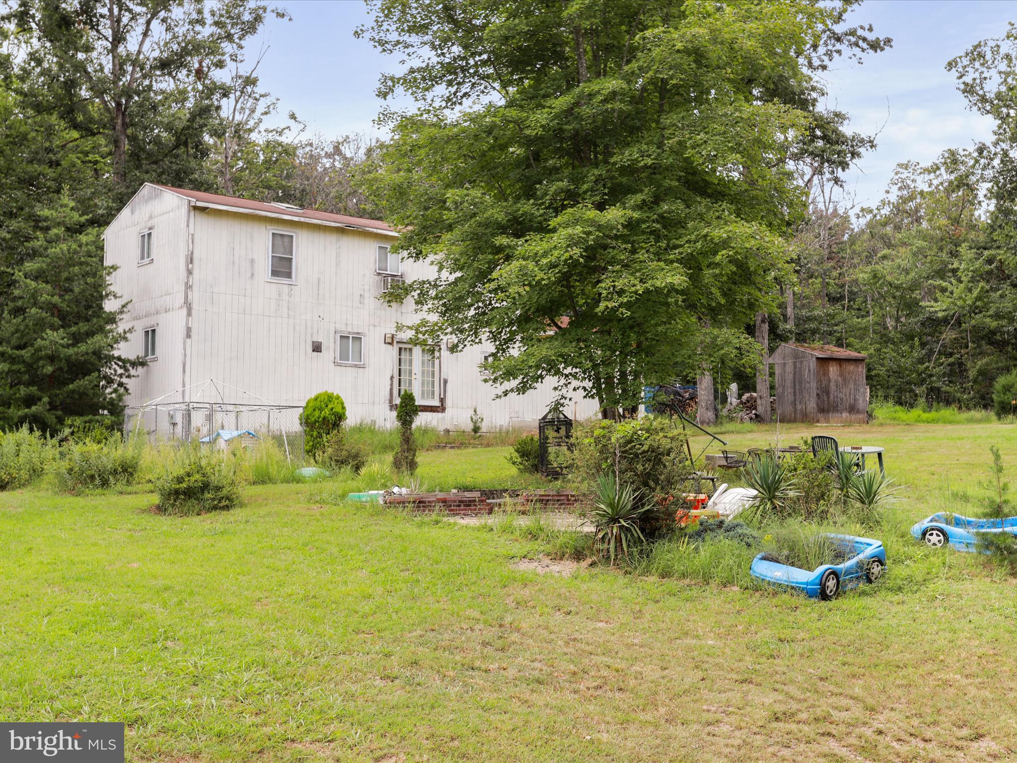 525 Rolling Rock Road Star Tannery, VA 22654 - Photo 47 of 69 a backyard of a house with plants and large trees