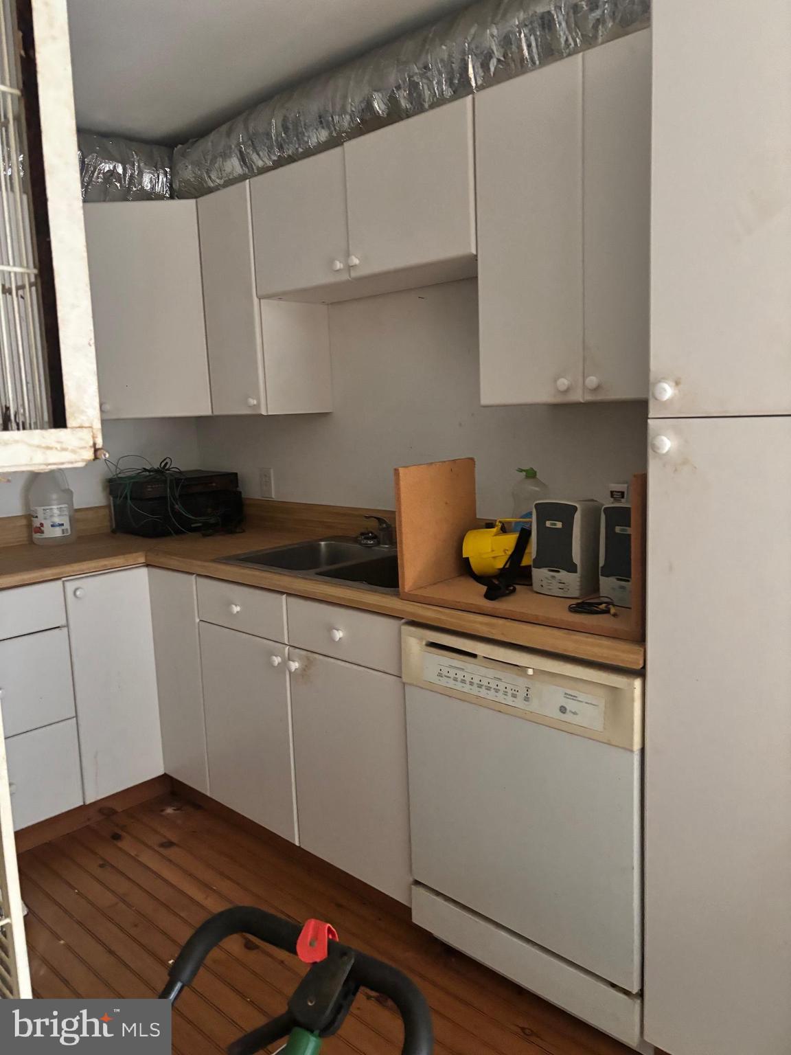 525 Rolling Rock Road Star Tannery, VA 22654 - Photo 54 of 69 a kitchen with granite countertop white cabinets and white appliances