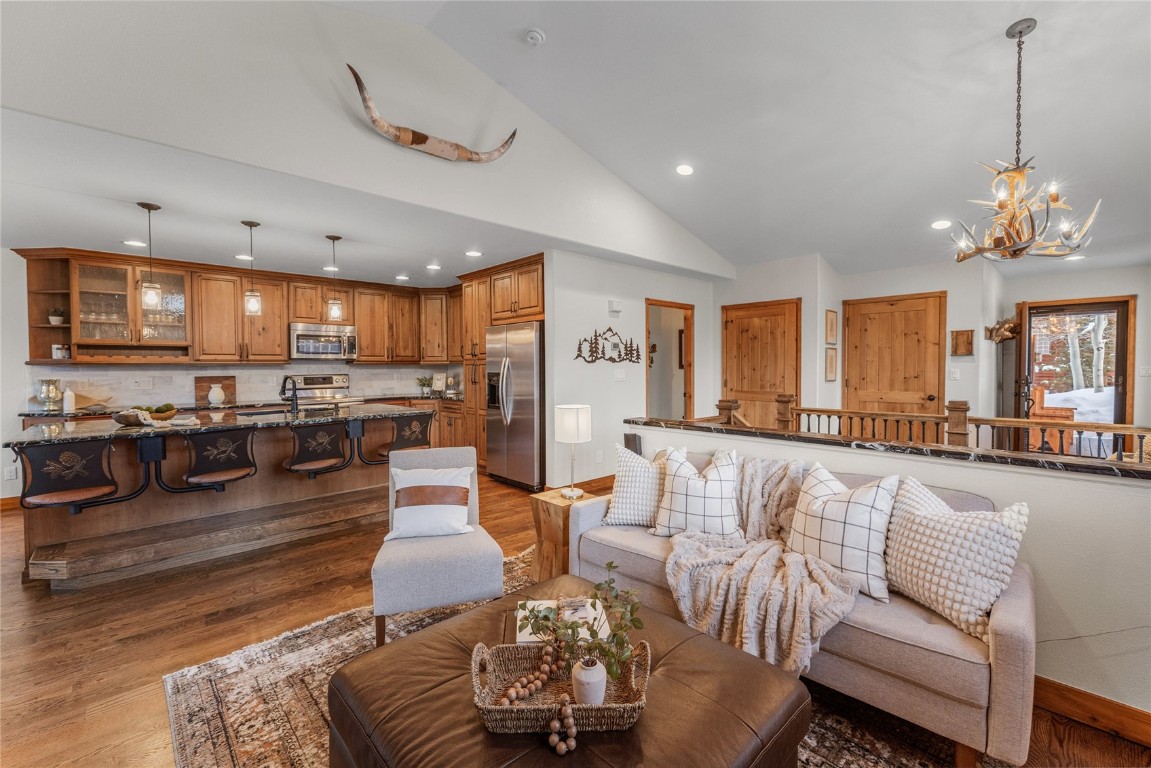 83 Lookout Ridge Drive, Unit 83 Dillon, CO 80435 - Photo 1 of 25 a living room with furniture kitchen view and a large window