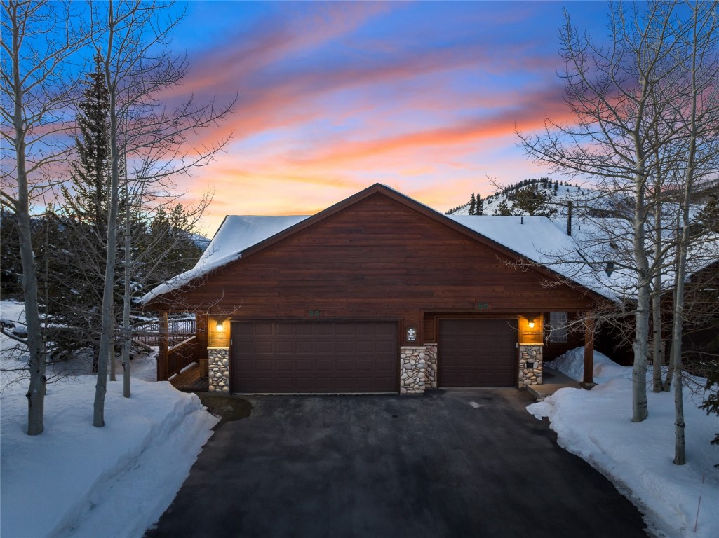 83 Lookout Ridge Drive, Unit 83 Dillon, CO 80435 - Photo 4 of 25 a view of a house with backyard and a tree