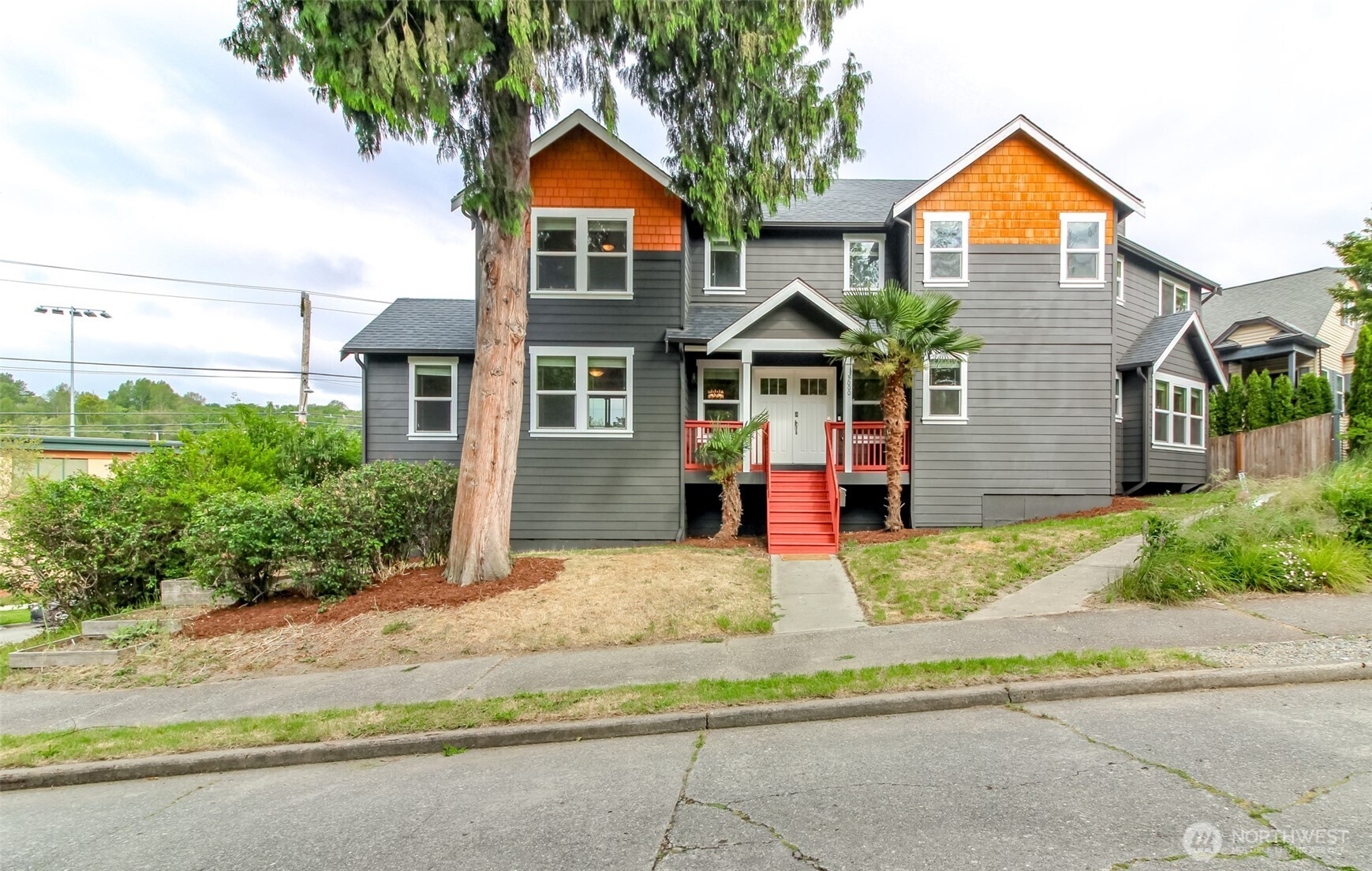 3000 South Mt Baker Boulevard Seattle, WA 98144 - Photo 2 of 40 a front view of a house with a yard and garage