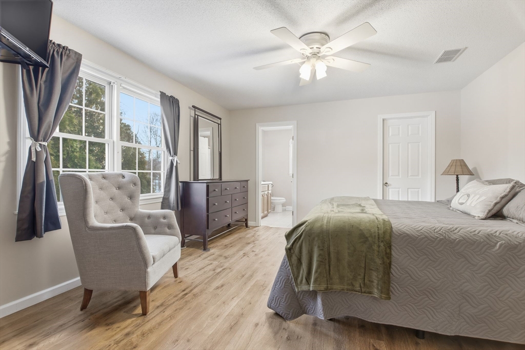 2 John Mason Road Southwick, MA 01077 - Photo 20 of 41 a bedroom with a bed and wooden floor