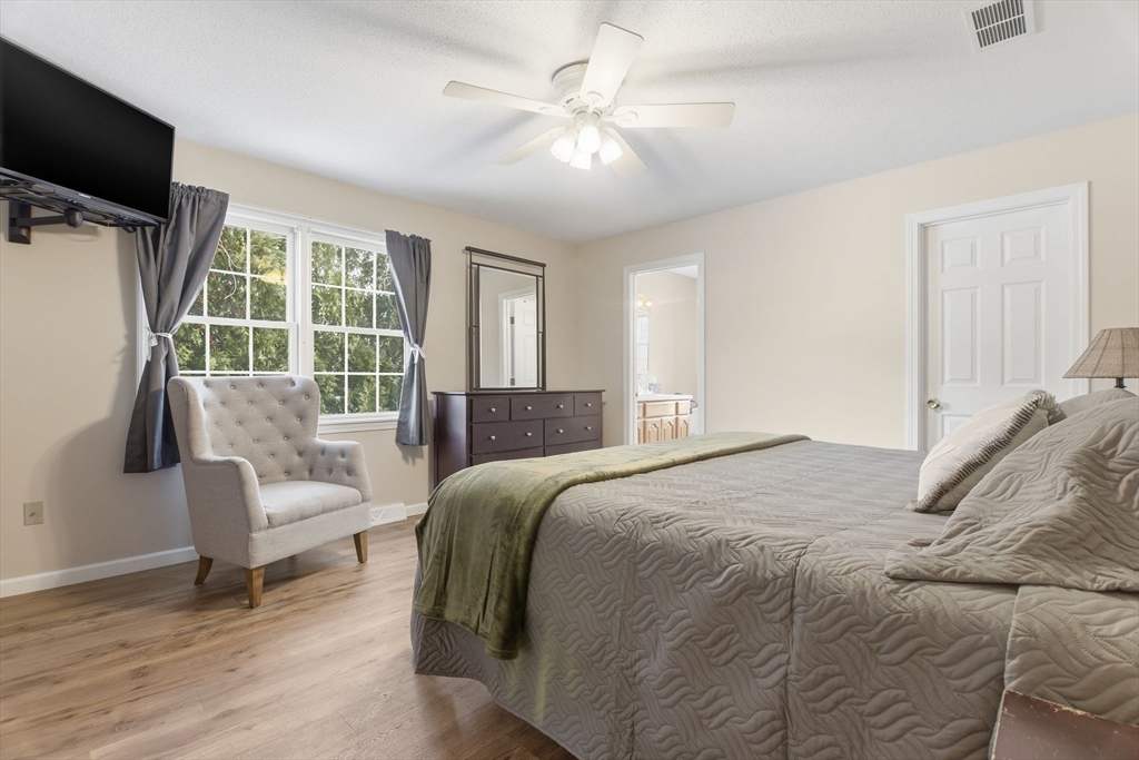 2 John Mason Road Southwick, MA 01077 - Photo 23 of 41 a bedroom with a bed and a flat screen tv