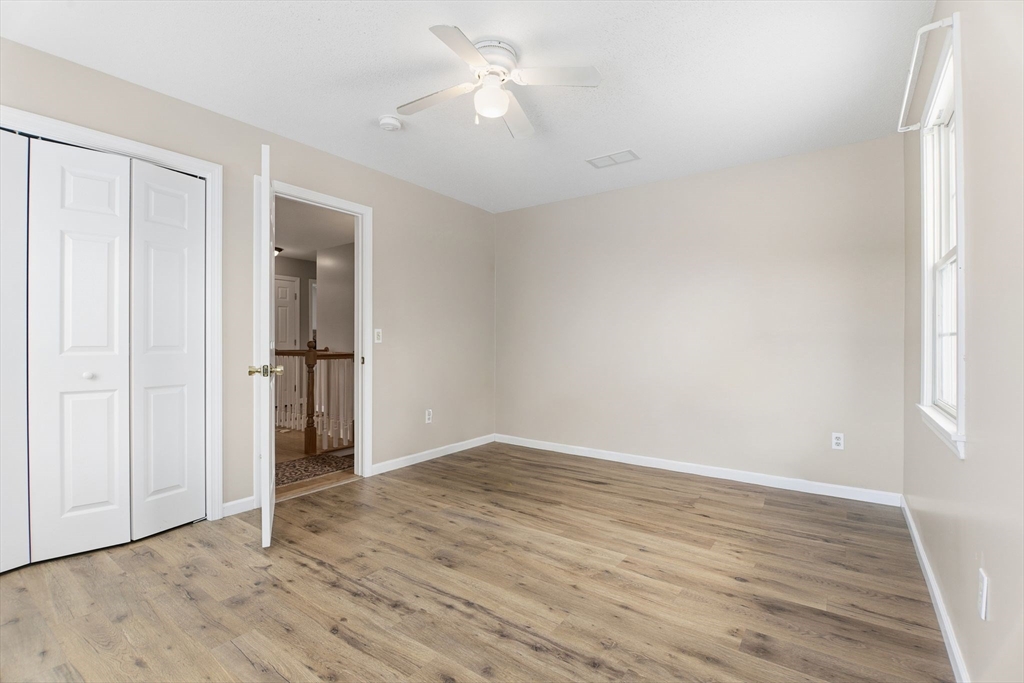 2 John Mason Road Southwick, MA 01077 - Photo 31 of 41 an empty room with closet and a ceiling fan