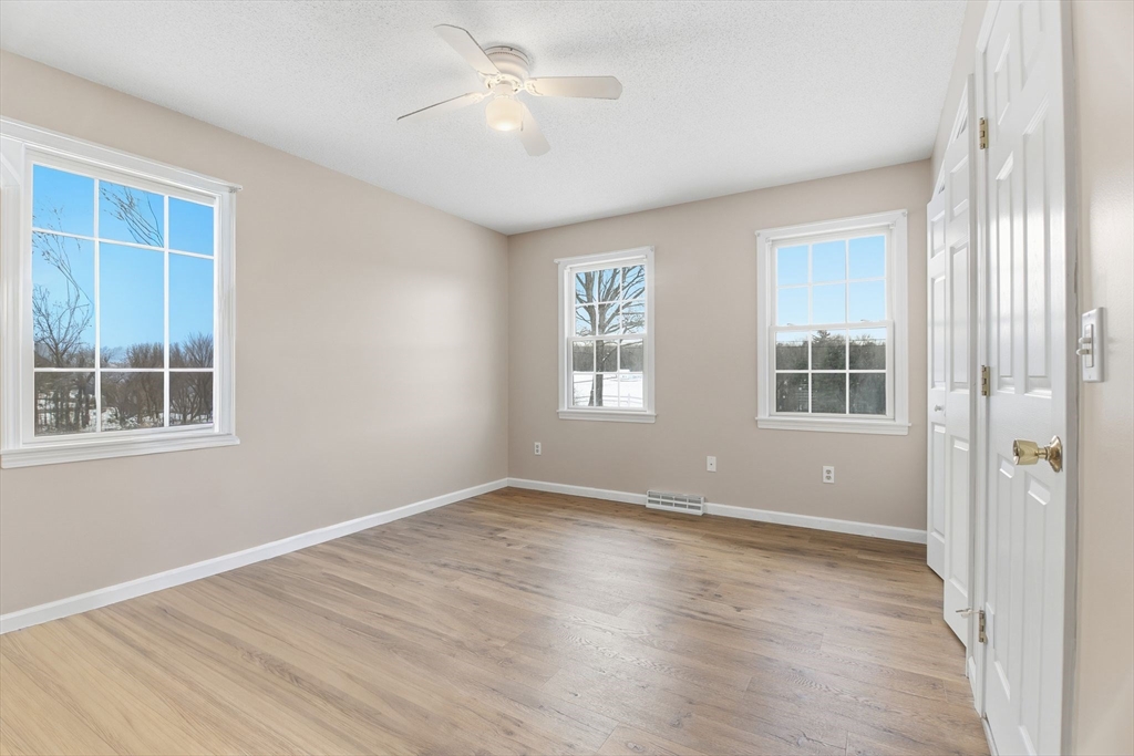 2 John Mason Road Southwick, MA 01077 - Photo 32 of 41 wooden floor in an empty room with a window