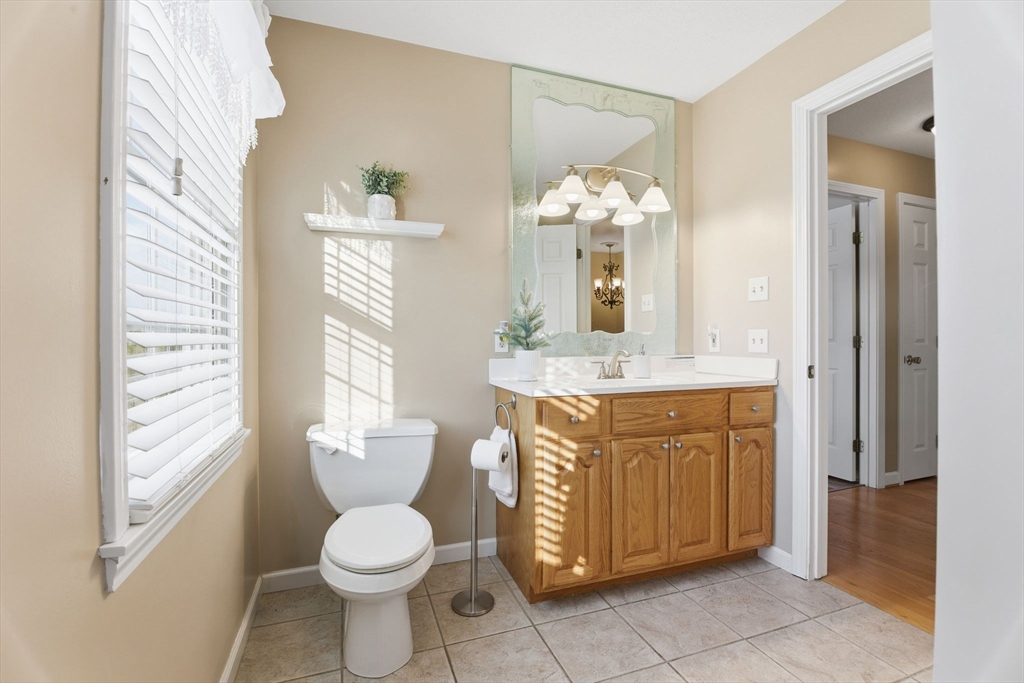 2 John Mason Road Southwick, MA 01077 - Photo 36 of 41 a bathroom with a granite countertop toilet sink and mirror
