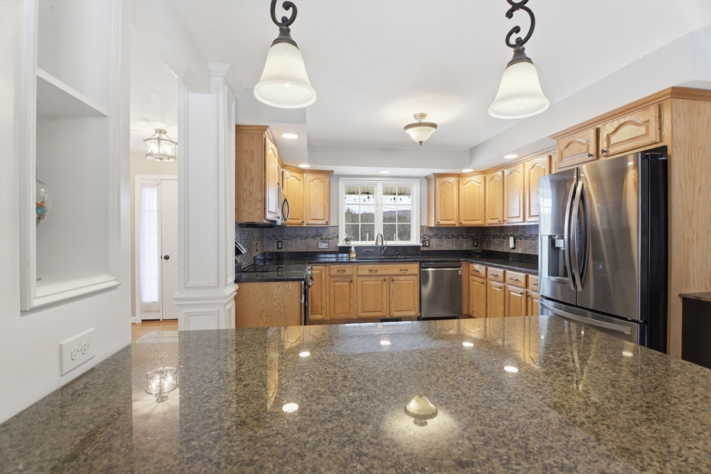 2 John Mason Road Southwick, MA 01077 - Photo 7 of 41 a large kitchen with granite countertop a large counter top appliances and cabinets
