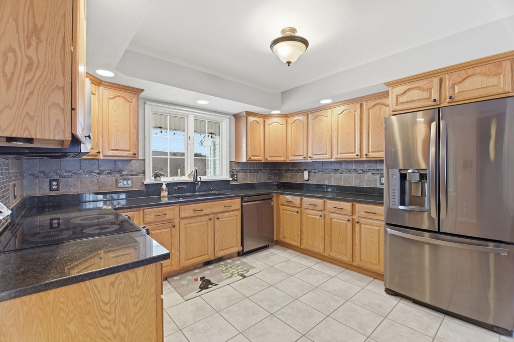 2 John Mason Road Southwick, MA 01077 - Photo 8 of 41 a kitchen with granite countertop a refrigerator sink and cabinets