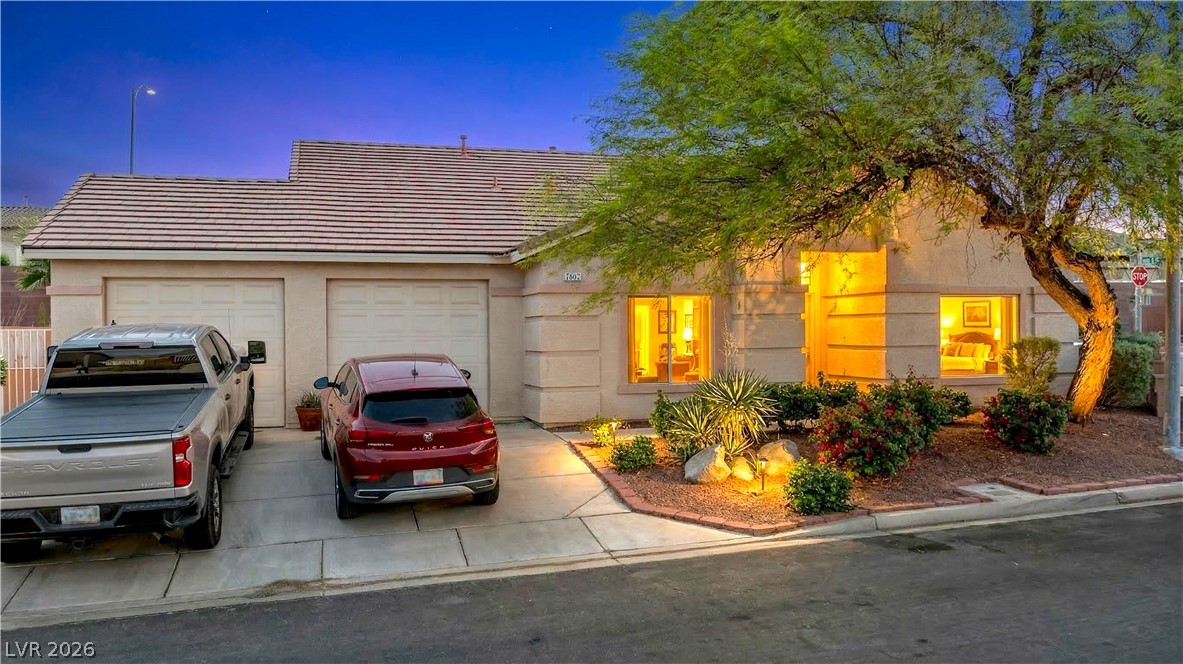 2823 Rippling Springs Street Laughlin, NV 89029 - Photo 1 of 89 View of front of home with a garage, a tiled roof, driveway, and stucco siding