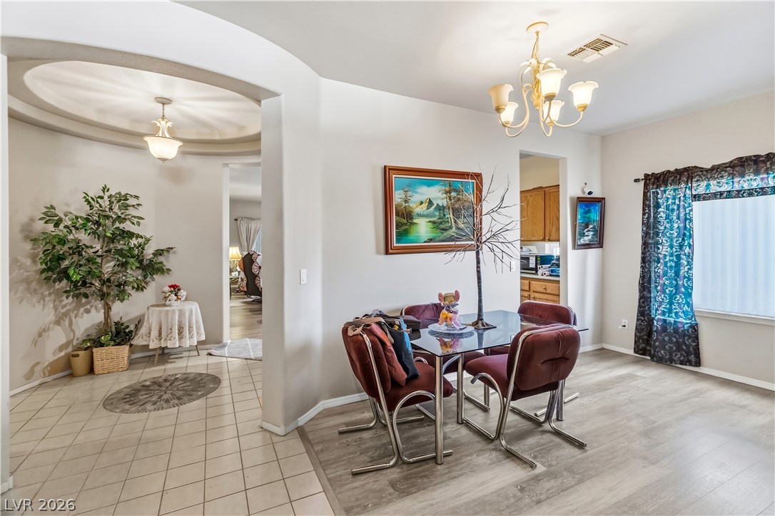 2823 Rippling Springs Street Laughlin, NV 89029 - Photo 11 of 89 Dining area featuring suspended lighting and light wood-style flooring