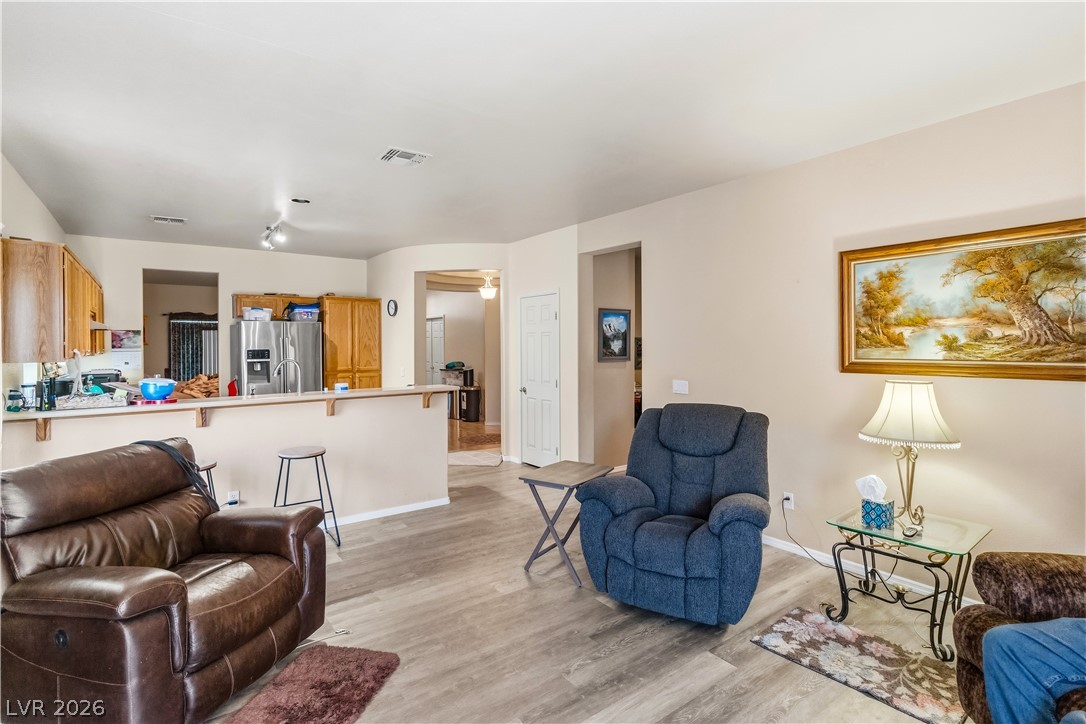 2823 Rippling Springs Street Laughlin, NV 89029 - Photo 20 of 89 Living room featuring light wood-style flooring and baseboards