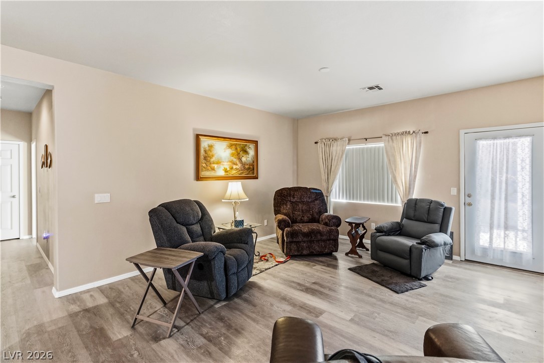 2823 Rippling Springs Street Laughlin, NV 89029 - Photo 21 of 89 Living room with light wood-type flooring and baseboards