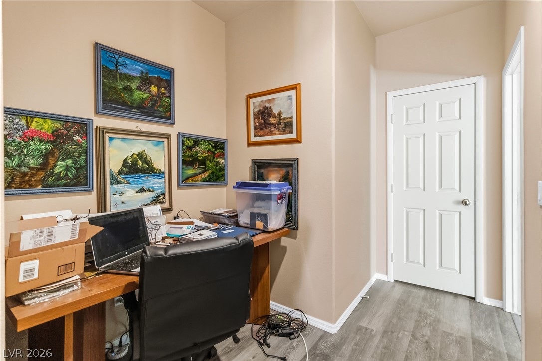2823 Rippling Springs Street Laughlin, NV 89029 - Photo 25 of 89 Hallway to Primary featuring light wood-style floors and nook space, perfect for a desk or table/cabinets