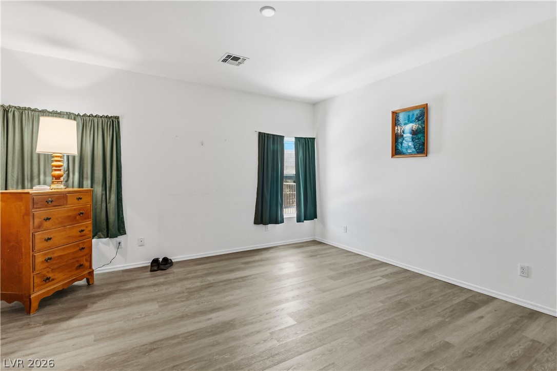 2823 Rippling Springs Street Laughlin, NV 89029 - Photo 26 of 89 Primary bedroom featuring light wood-type flooring and baseboards