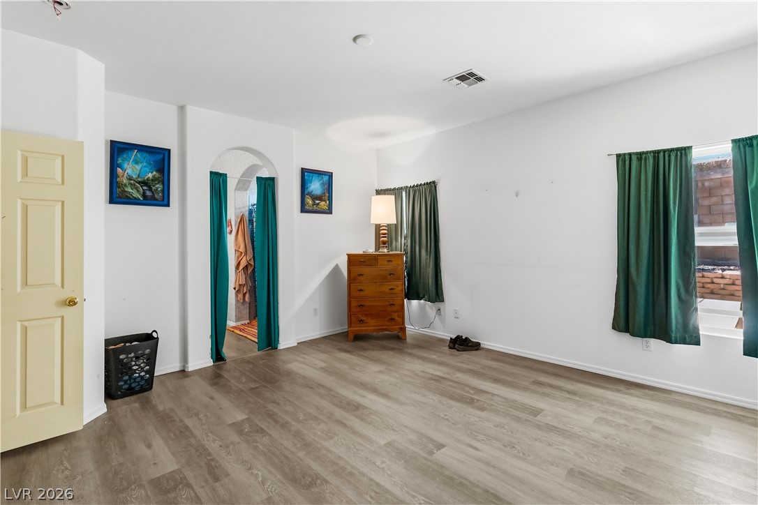 2823 Rippling Springs Street Laughlin, NV 89029 - Photo 27 of 89 Primary bedroom featuring light wood finished floors and baseboards