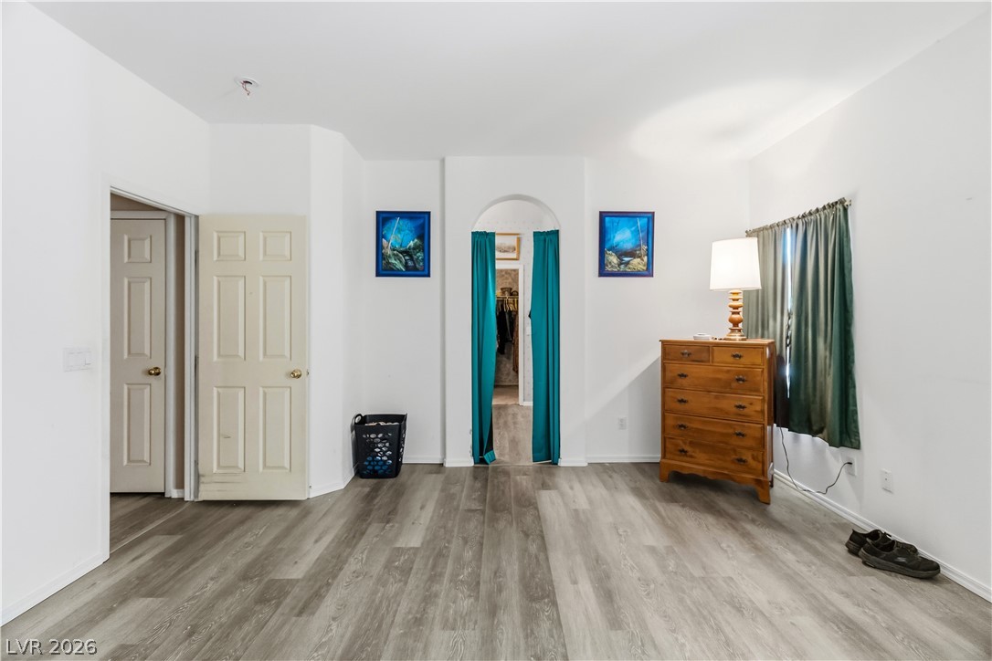 2823 Rippling Springs Street Laughlin, NV 89029 - Photo 28 of 89 Primary bedroom with light wood-style flooring and baseboards