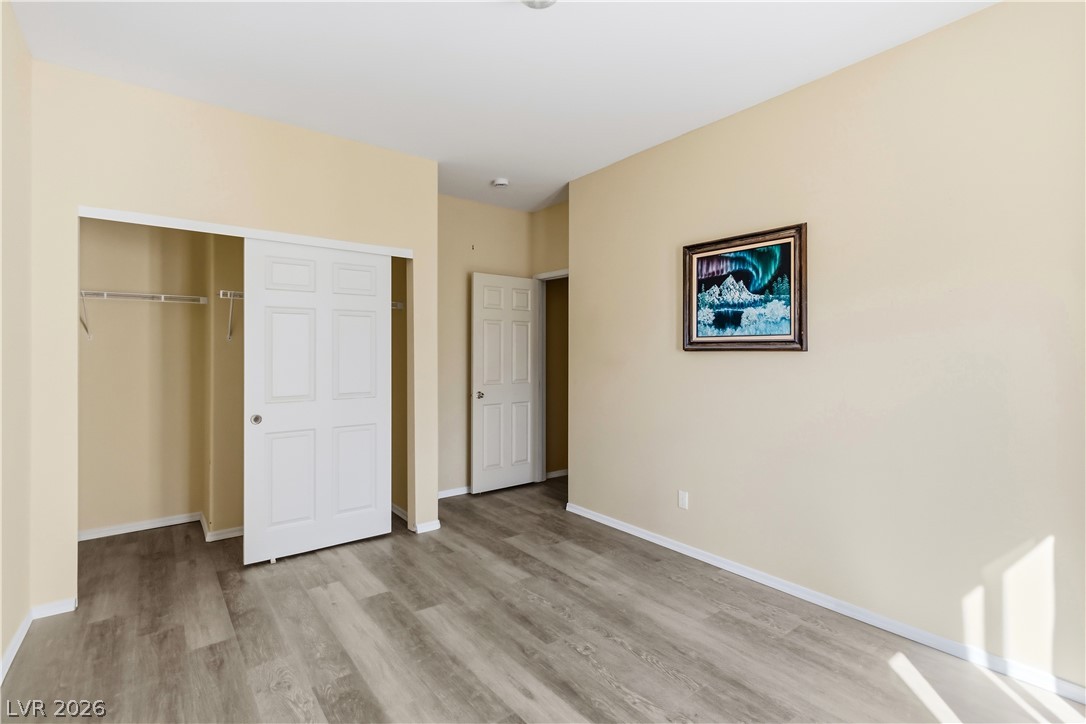 2823 Rippling Springs Street Laughlin, NV 89029 - Photo 44 of 89 Second bedroom featuring a closet and light wood-type flooring