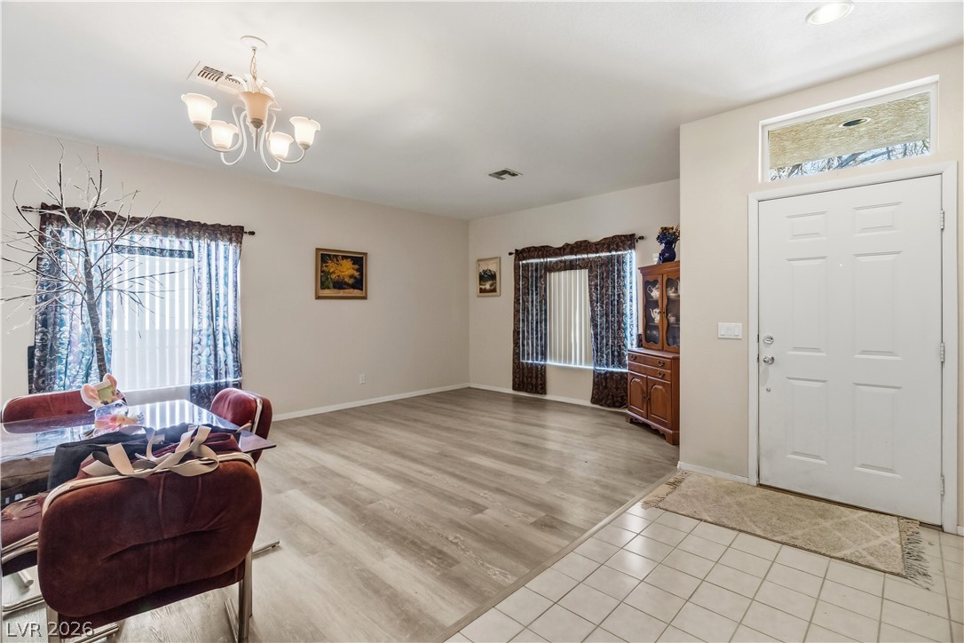 2823 Rippling Springs Street Laughlin, NV 89029 - Photo 5 of 89 Entryway featuring light vinyl plank floors and suspended lighting