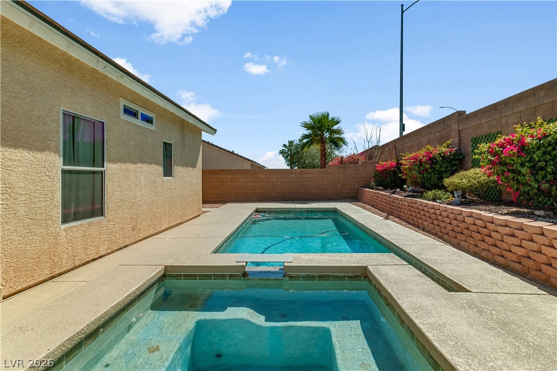 2823 Rippling Springs Street Laughlin, NV 89029 - Photo 60 of 89 Combined pool / hot tub with a patio area and a fenced backyard